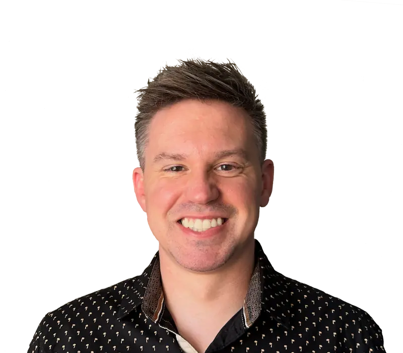 Joel Wisneski, a product designer smiling at the camera